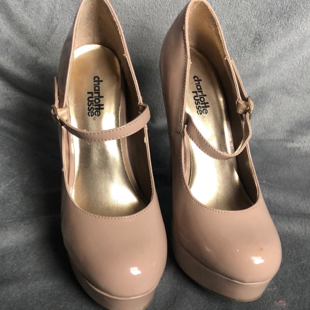 Nude patent pumps
